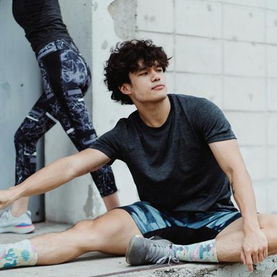Man stretching his arms, preparing for a workout.